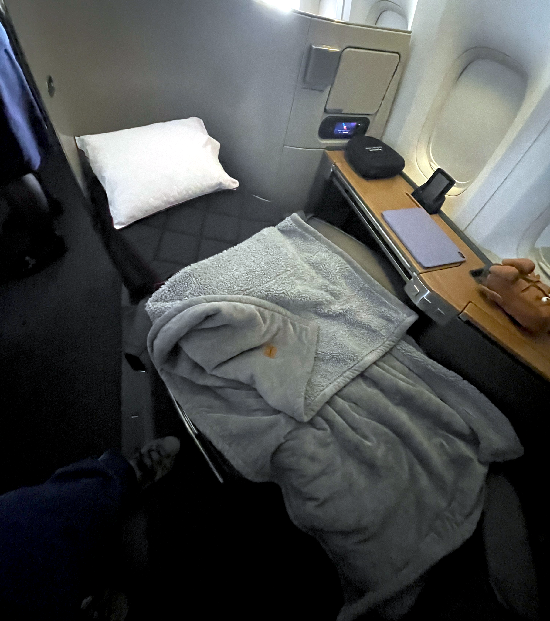 A first class seat made up as a bed