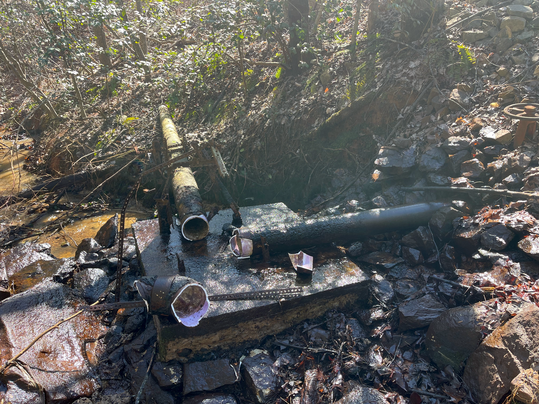 Picture of a broken pipe on the ground