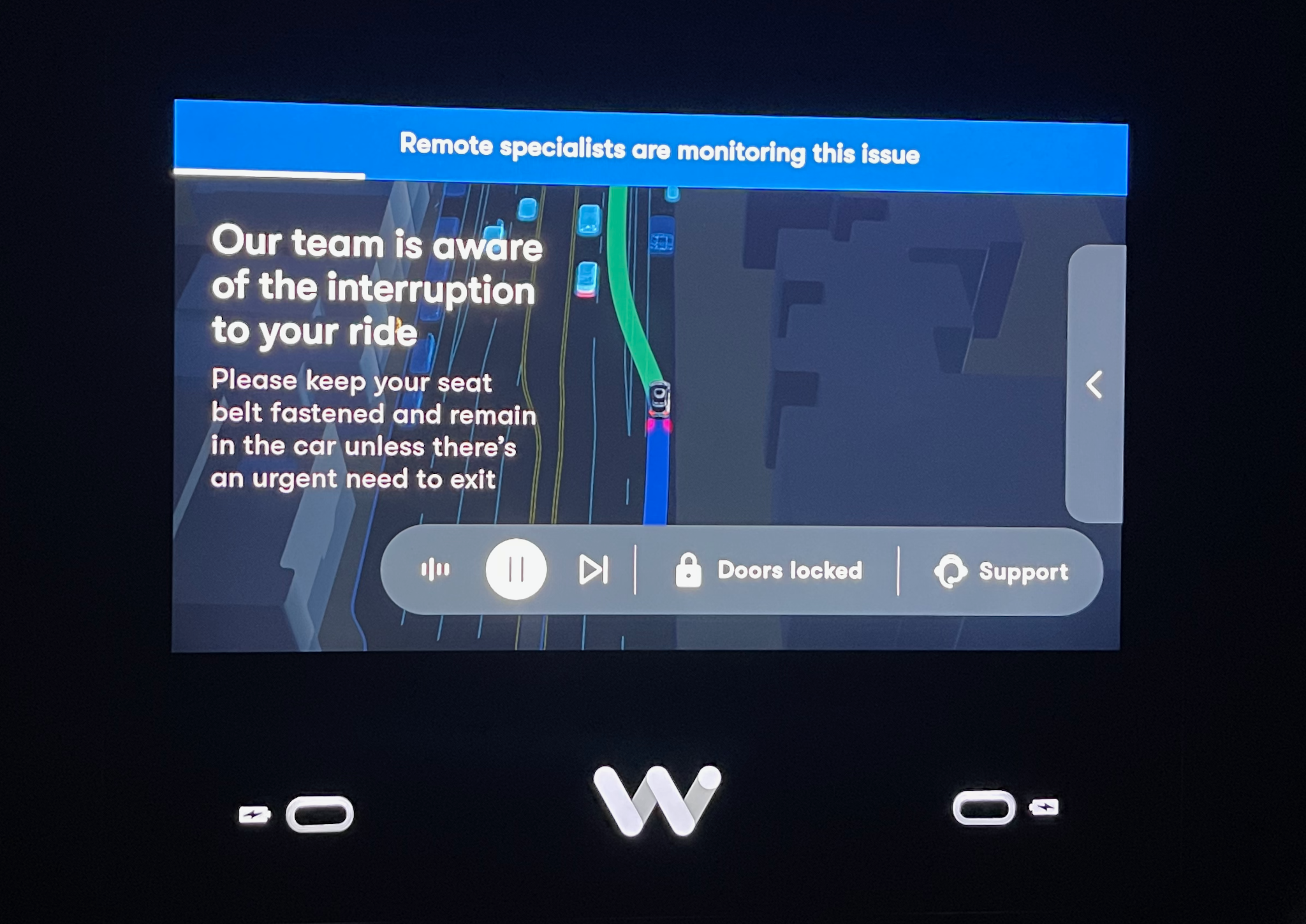 A Waymo screen showing a message that someone on the team was looking into an error