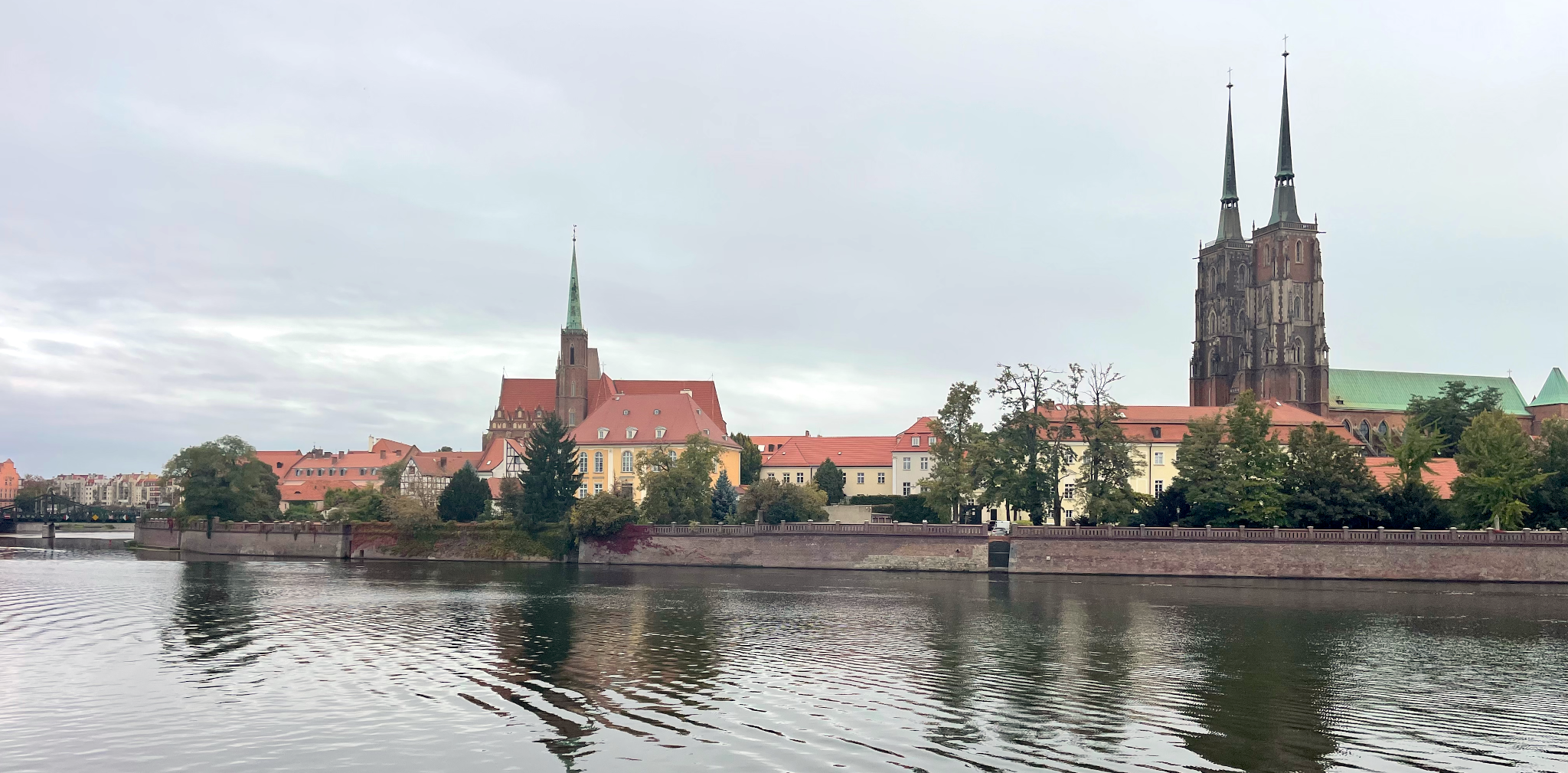 View of buildings and a large church across a river